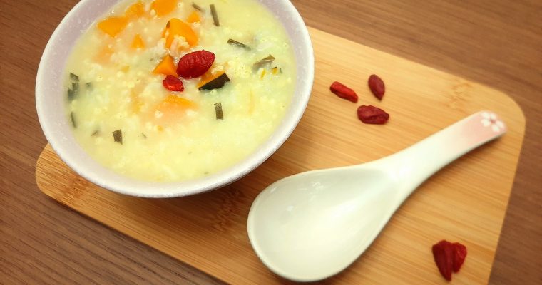 Millet congee garnished with goji berries