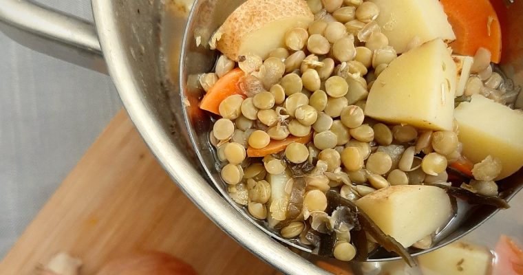 Green Lentils, potatoes and carrots in a ladle