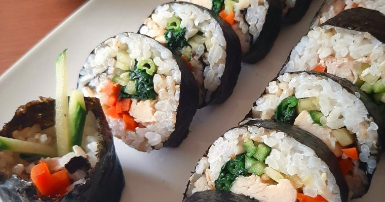 Chicken kimbap rolls with kelp soup in the background