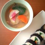Watermelon sunchoke soup with spinach and carrots top view