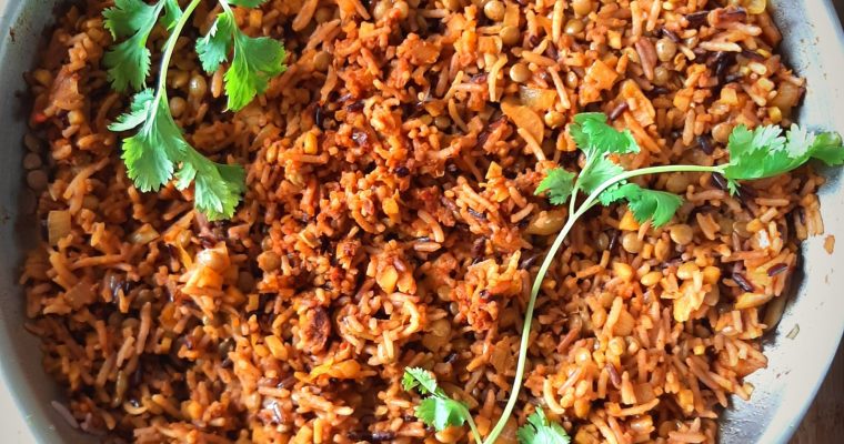 Tomato curry rice in a skillet top view