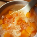 Papaya snow fungus sweet soup in a bowl with a spoon