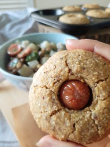 Gluten-free Corn dog muffin top view with potato lentil stew in the background