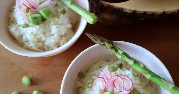 Dandelion ochazuke with pickpled onion and asparagus on top