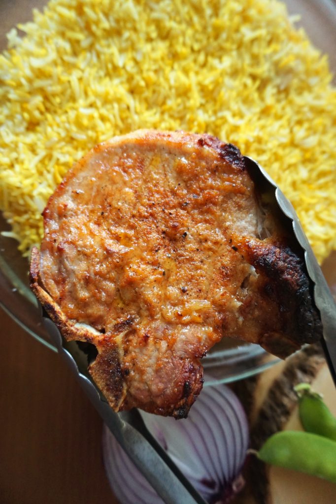 Baked Pork Chop over Yellow rice