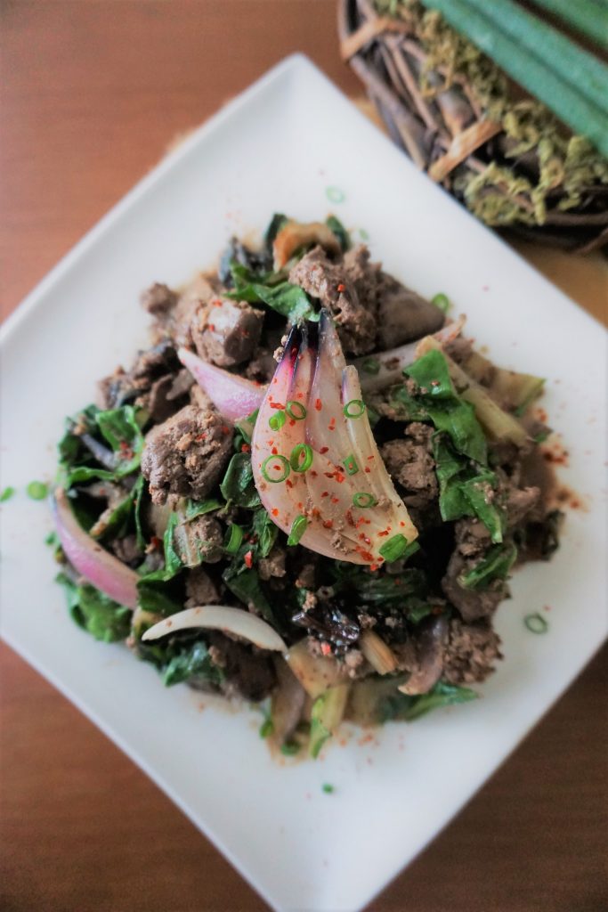 Chicken liver and onions with swiss chard top view
