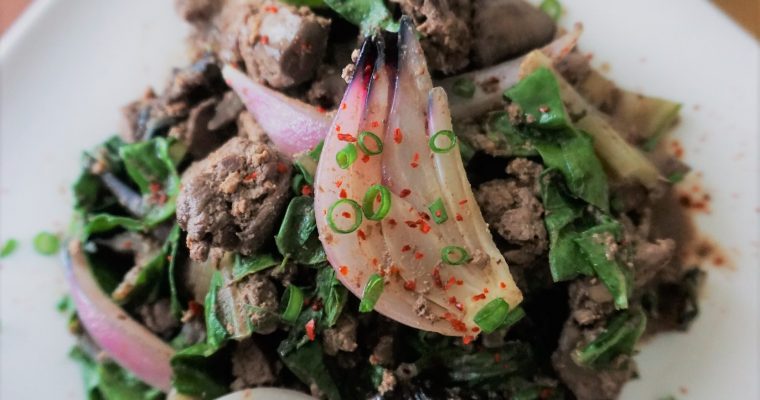 Chicken liver and onions with swiss chard top view