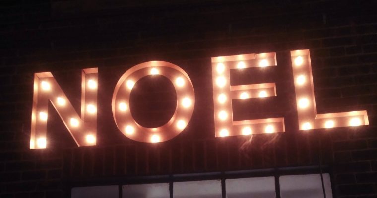 NOEL light bulb sign on the wall