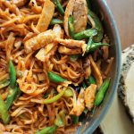 Allergy-friendly chicken Pad Thai in a pan top view