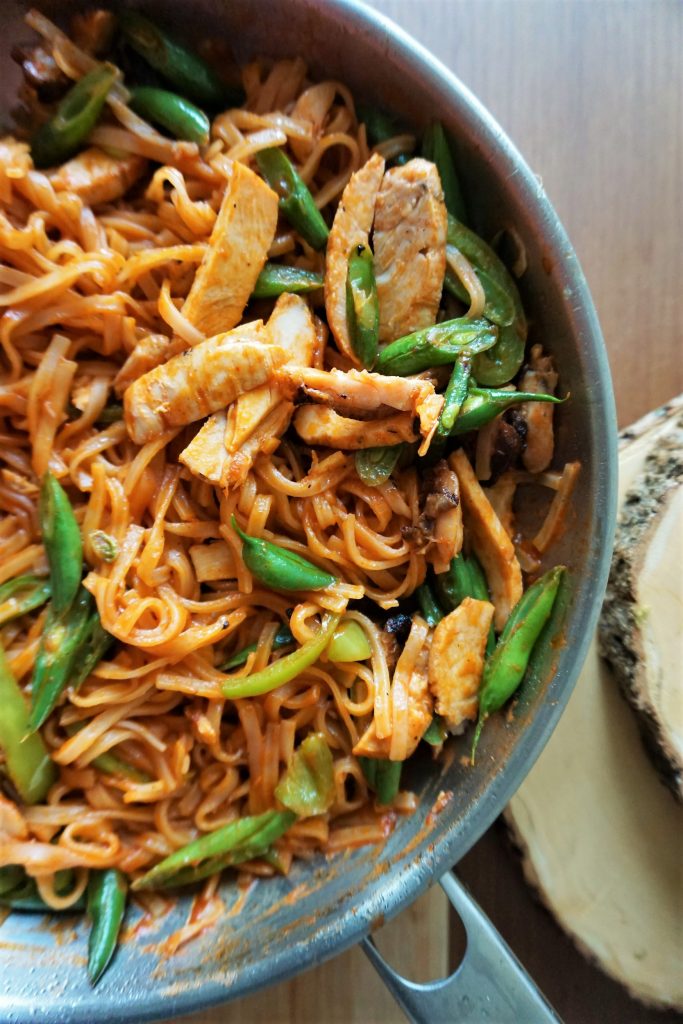 Allergy-friendly chicken Pad Thai in a pan top view