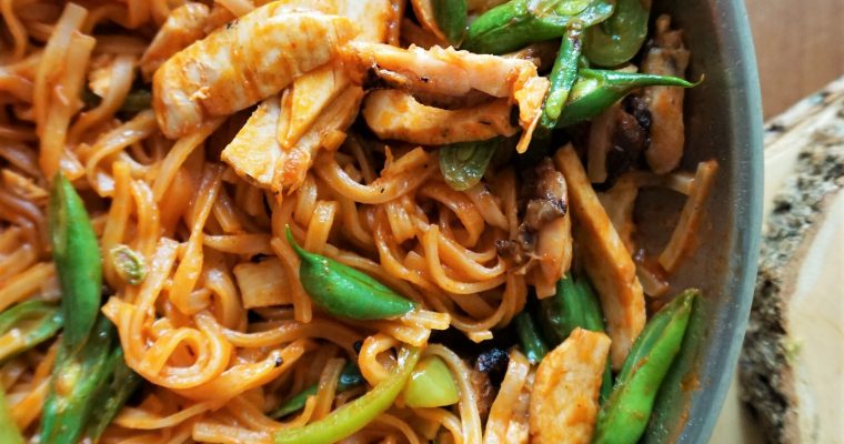 Allergy-friendly chicken Pad Thai in a pan top view