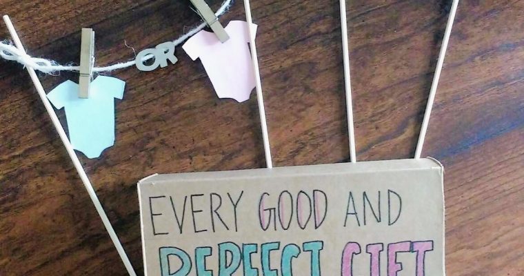 Top view of second trimester gender reveal props