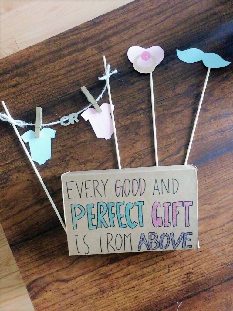 Top view of second trimester gender reveal props
