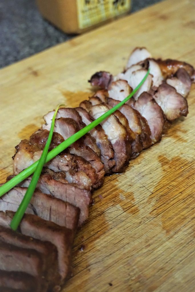 Cantonese barbeque pork cut with green onions on top
