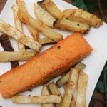 Pan-seared salmon with celeriac fries on a plate