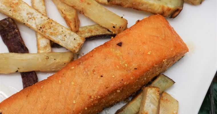 Pan-seared salmon with celeriac fries on a plate