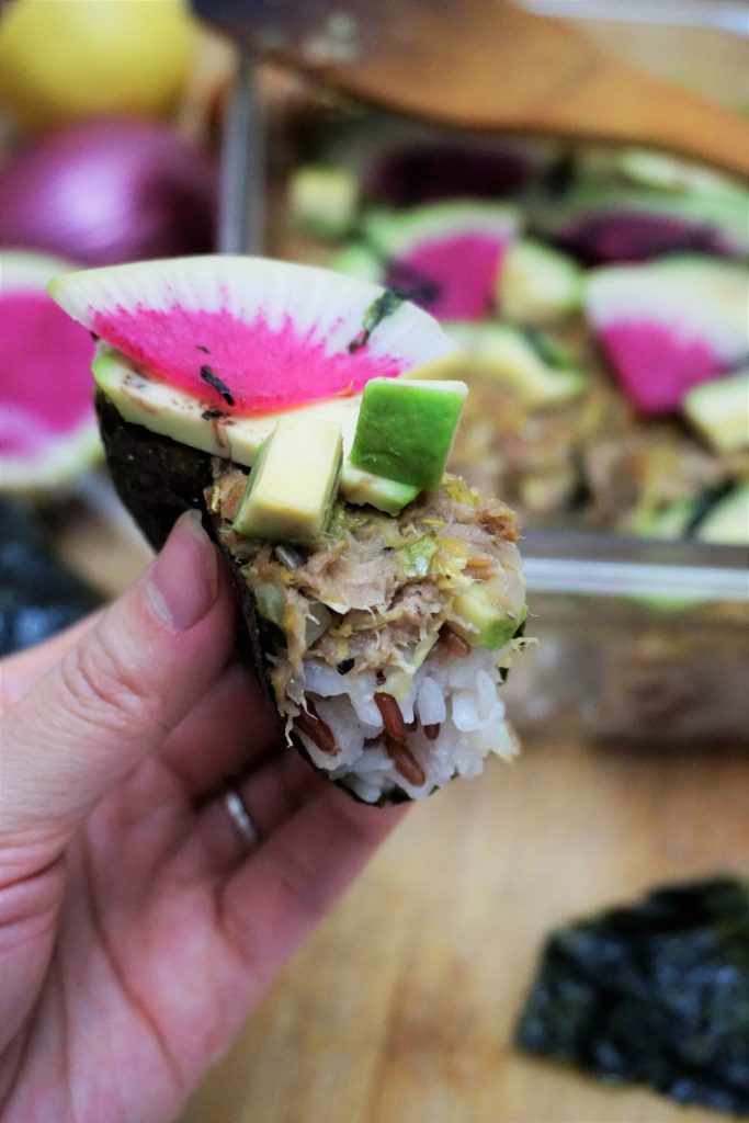 Tuna sushi bake hold with nori
