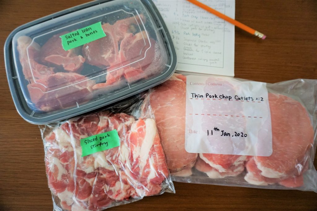 Pork chops prepped into cutlets portions, salted bones and stir fry pieces