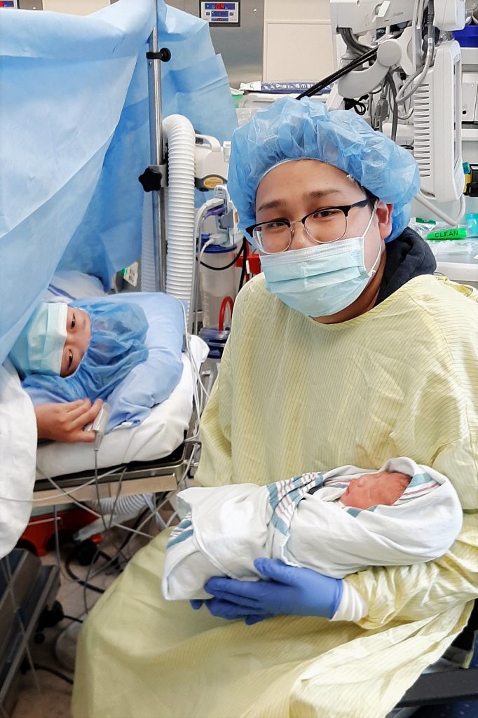 family photo in operation room right after birth