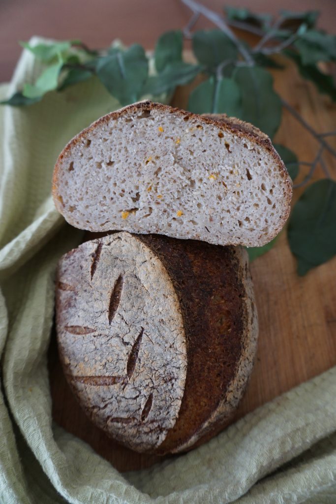 Gluten-free sourdough with orange zest, top and cut crumb shot