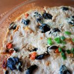 Meat patty with black fungus close up in a glass dish