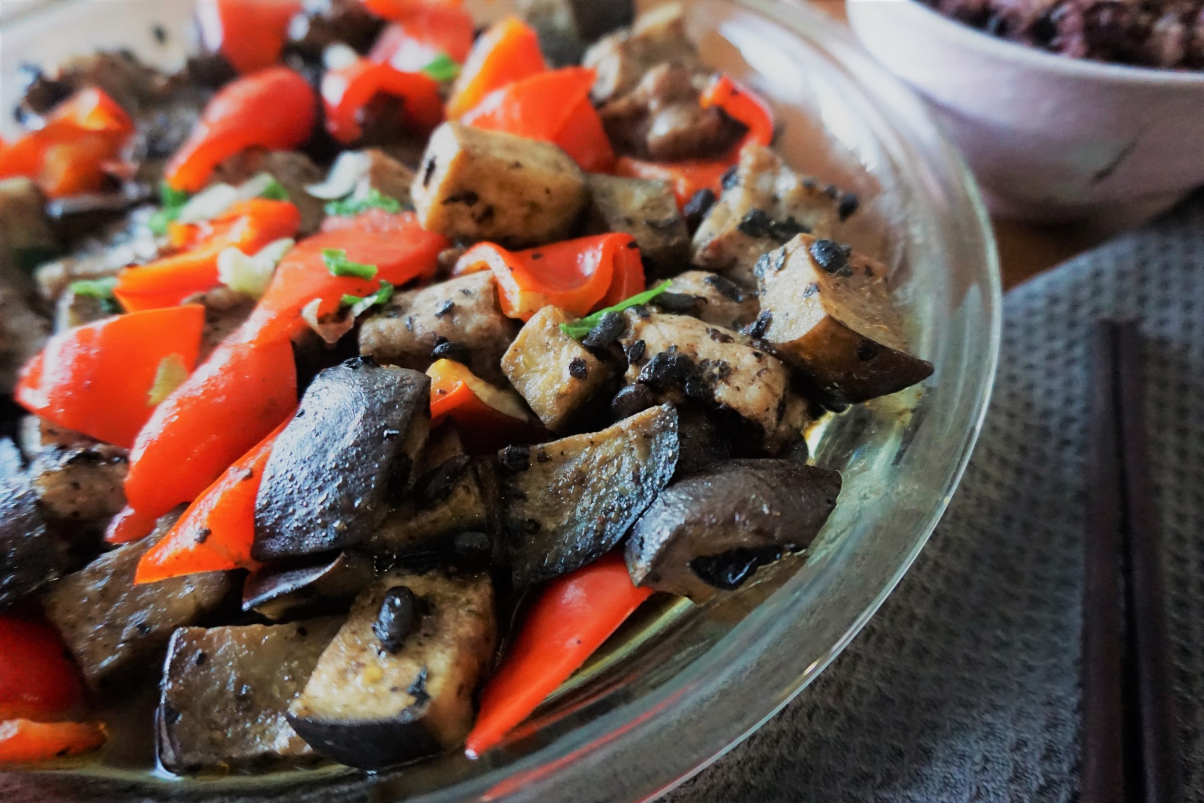 Steamed spare ribs in a glass dish at an angle